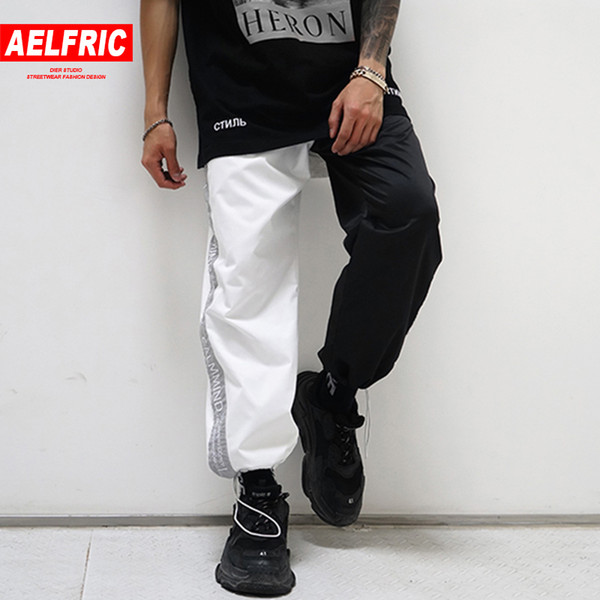 AELFRIC Black and White New Design 3M Reflective Letter Harem Pants Men Women Summer Hip Hop Casual Joggers Tide Streetwear ZY26