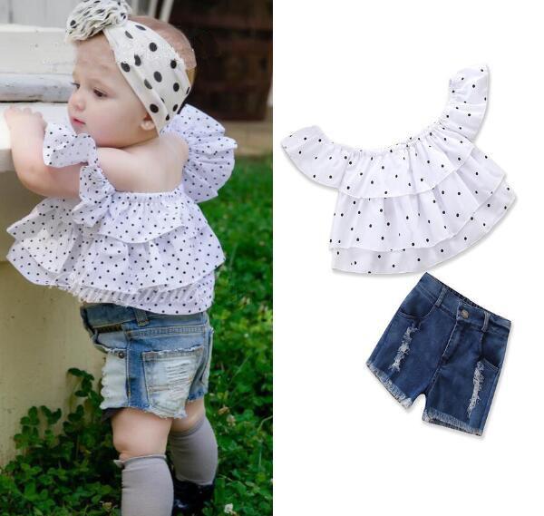 New children's clothes suit summer Europe and the United States wind girl white dot one shoulder shirt + hole denim shorts two-piece