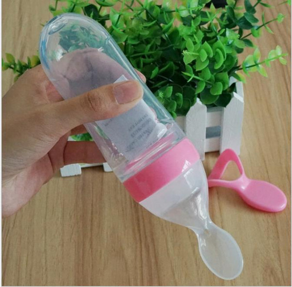 Wholesale - Hot Baby Squeeze Feeding Meal Rice Milk Bottle Feeding Spoon Baby Silicone Food Supplement