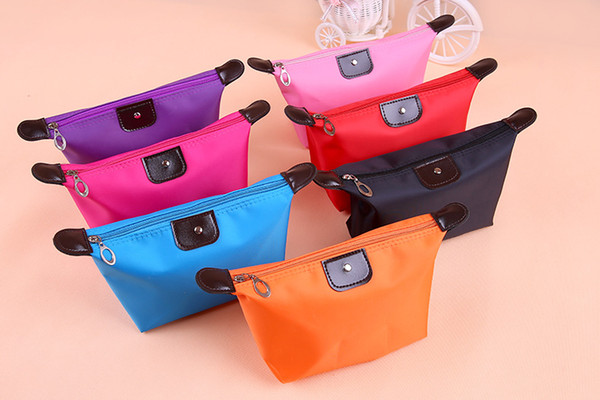 Best selling candy color ladies cosmetic bag multicolor dumplings package unisex travel storage bag outdoor essentials wholesale