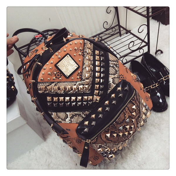2015 new fashion women and men backpack JTXS PU rivet serpentine patchwork backpack punk backpack leisure bags party bags two colors 637-2
