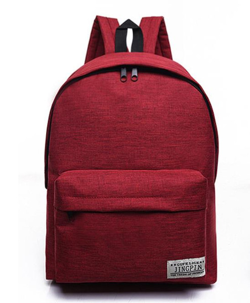 Wholesale pure color canvas backpacks female middle school students schoolbag han edition small fresh school wind backpack male fashionable