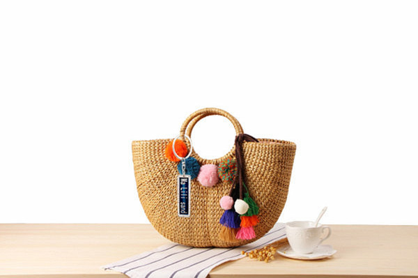 Wholesale Anti-Lost Hand-Woven Straw Bag Handmade Yellow Grass Weave Handbag Colorful Tassel Wool Ball Beach Bag