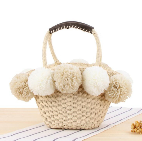 Factory wholesale women handbag summer new cute contrast big wool ball straw bag outdoor holiday beach bag sweet cute fur ball handbag