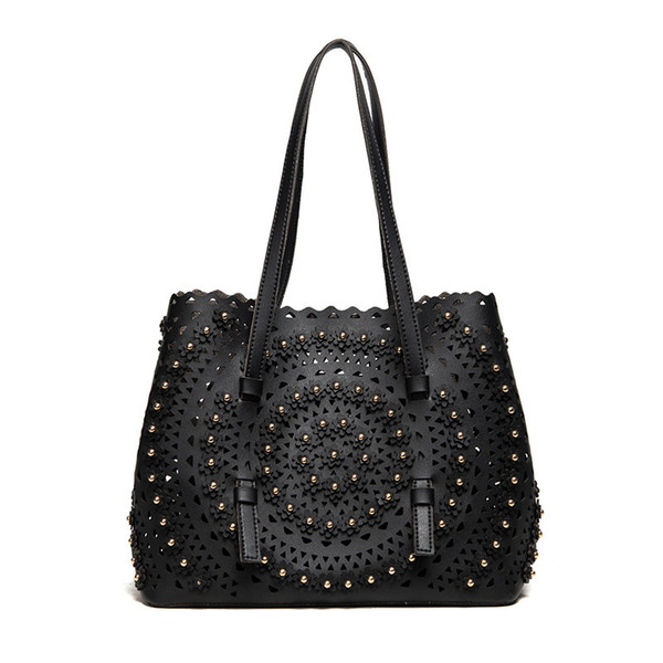 Hollow child bag Korean version of the new personality handbags fashion flower rivet shoulder portable handbags wholesale