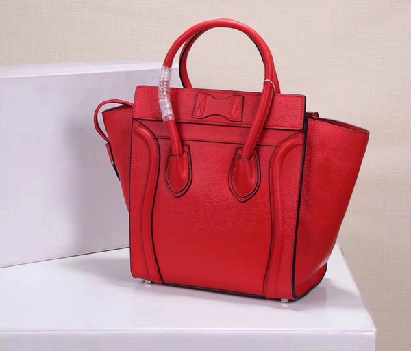 Classic famous brand female handbag high quality leather smile package bat bag free delivery.