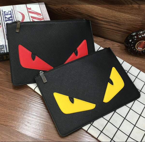 Little monster hand bag big eyes envelope bag soft leather black large capacity mobile phone wallet for men and women