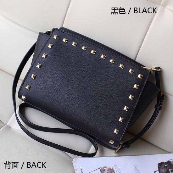 Free shipping 2016 star models with cross pattern PU leather handbags and small rivet smiley bat bag shoulder bag Messenger bag