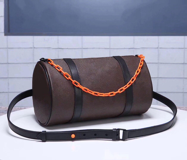 Men and women with the old flower cylinder diagonal shoulder bag tassel hanging chain drum bag sports fitness light embossed pillow bag