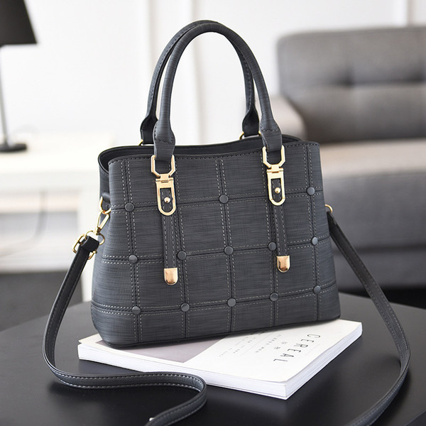 Bag female 2018 spring and summer new pu female bag Korean version of the button decorative handbag plaid package a generation