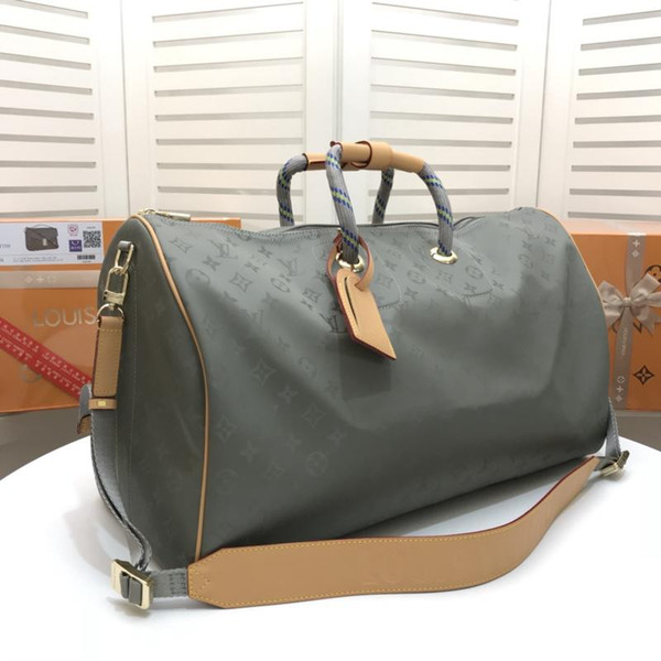 Large-capacity men's and women's travel bags sell quality leather men's and women's shoulder bags 50*29cm