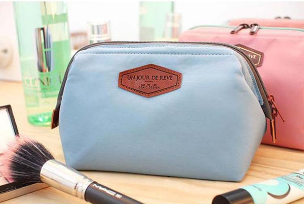 Korean version of the simple fashion storage bag portable cute cotton steel frame wash cosmetic bag