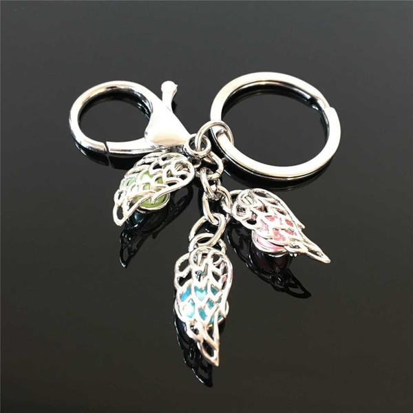 European and American popular feather pearl cage key ring can open hollow pearl noctilucent pearl volcanic stone pendant key ring