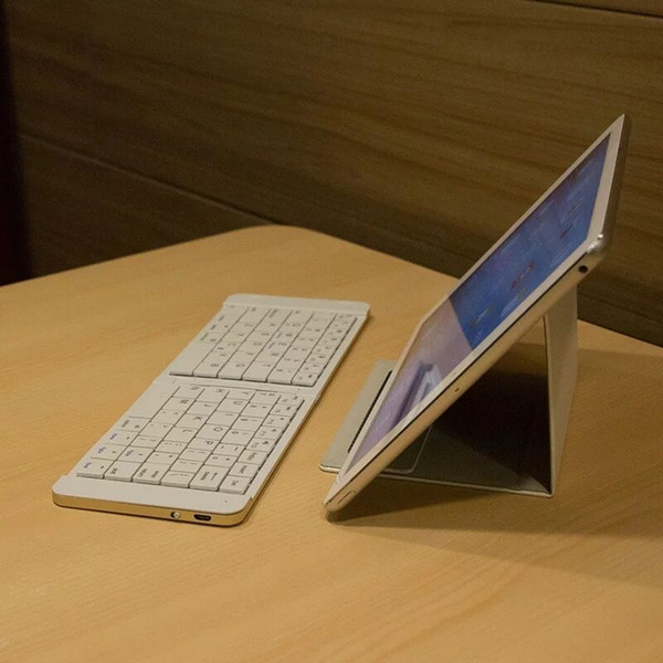 2018 new folding Bluetooth keyboard universal Android iPad mobile phone portable mini wireless keyboard plus keyboard protector sheath