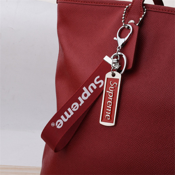 Fashion mobile phone ribbon letter key pendant creative metal tide brand keychain.So cool and good