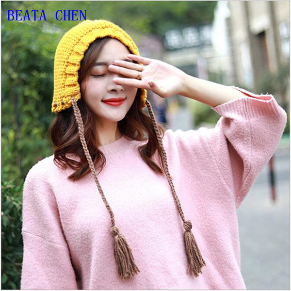 Autumn and winter new purely manual hair hat children Korean tassel braid knitted hat day wear warm ear protection