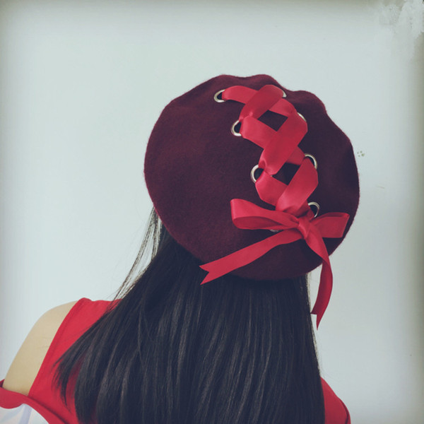 Korean version with a bow woolen beret beret autumn winter buds literary artist cap to match the black fashionable girl