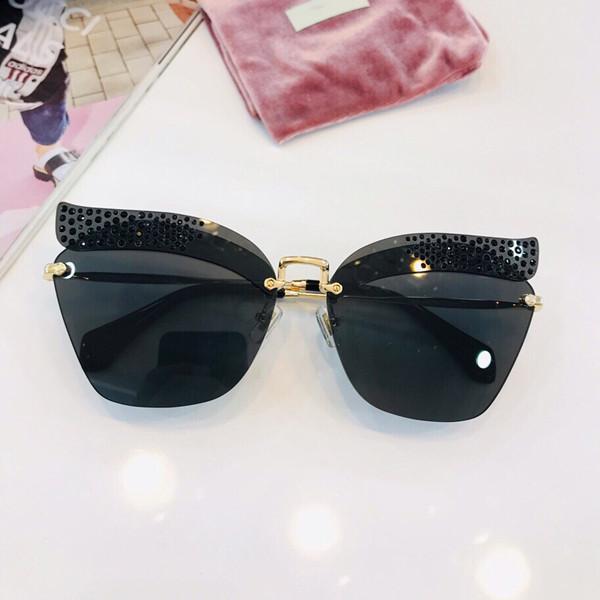 New hot selling brand glasses SMU56 frameless charming cat eye sunglasses for womens trend avant-garde style uv400 lens top quality eyewear