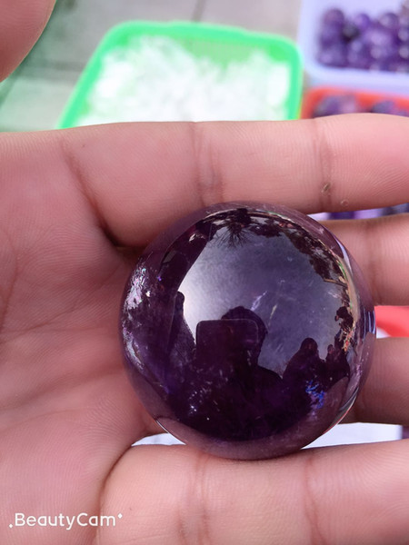 Natural amethyst ball. Very beautiful. Like the single oh. A friend