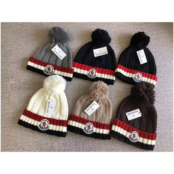 Hot Sale Men And Women Luxury Brand Fashion New Design Striped Knit Newspaper Hat Unisex Winter Warm Wool Woven Pom-pom Cap 