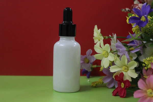 wholesale 100pcs white color glass 1 ounce dropper bottles with black cap , 1 oz dropper bottle glass with aluminium black cap
