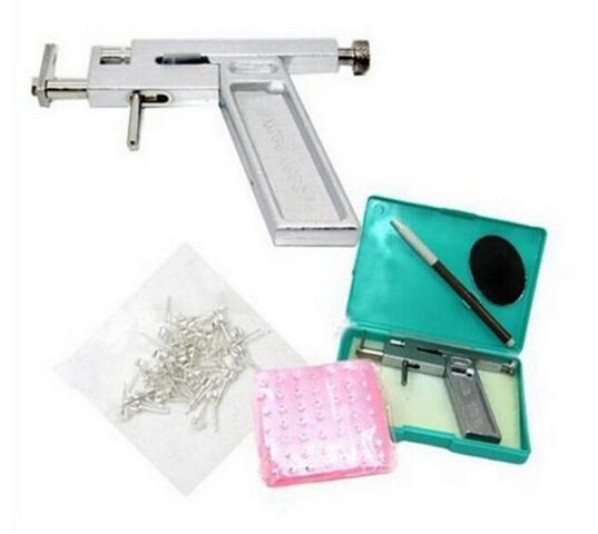 NEW ARRIVAL Professional Ear Body Nose Piercing Gun Machine Tool Kit Set + 98Pcs Steel Studs Piercing the Ear Guns Iron Suit Free Shipping