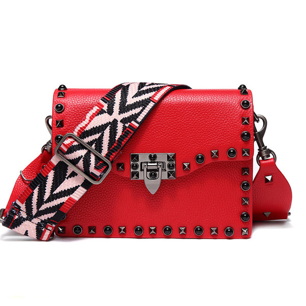 Party gift shoulder diagonal wide shoulder strap handbags really leather handbags Europe and the United States fashion rivet package Valenti