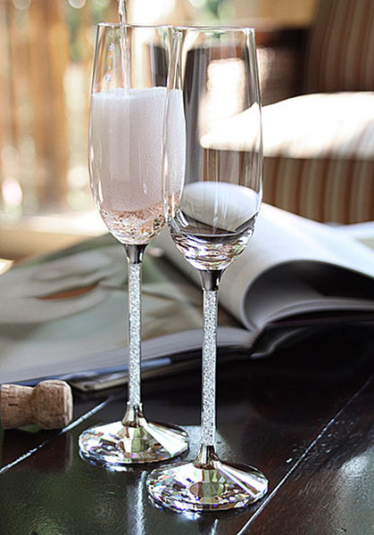 Crystalline champagne glasses toasting flutes in pair with crystal facet base and sparkle diamond stem as wedding gift