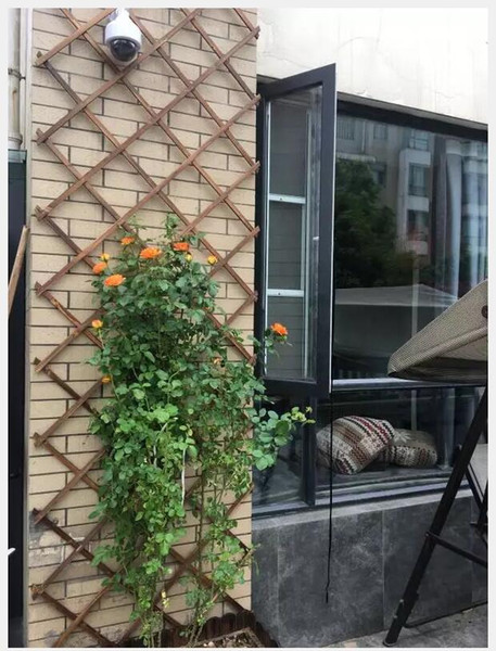 Wooden fence Carbonized and anticorrosive wood fence telescopic wood netting wood fence wall grid flower rack climbing vine