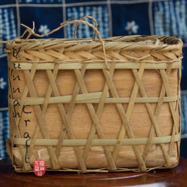 2011 Yi Wu Gu hua - autumn tea leafs pressed into the bamboo basket , Pu-erh Raw Tea from Southern Yunnan
