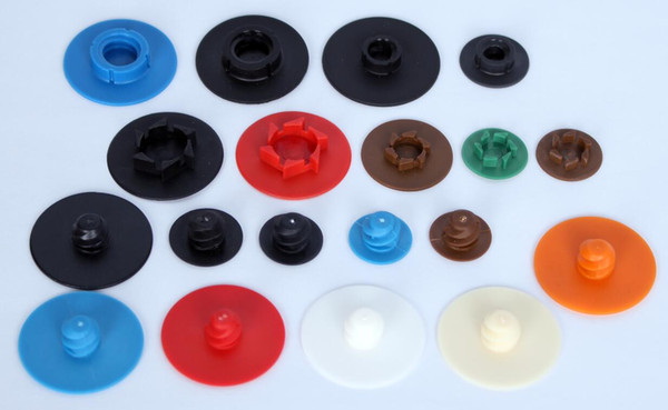 Plastic buttons for quick change disc/abrasive