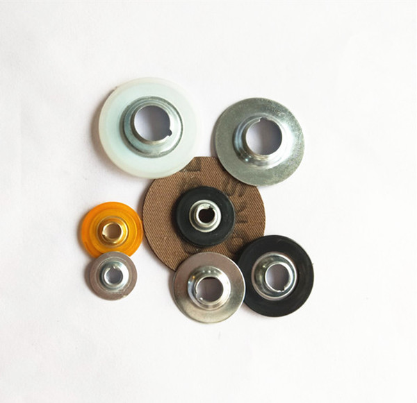 Metal plastic buttons for quick change disc