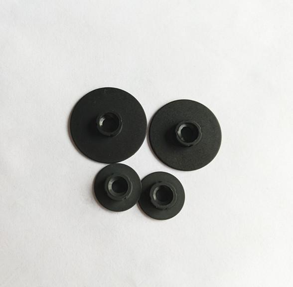 Nylon buttons for quick change disc