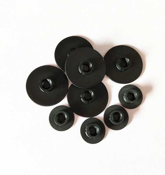 Quick change disc plastic buttons