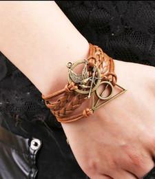 New limited zinc alloy women trendy rope chain 2014 infinity hungry games bird charm bracelet imitation leather wax cords