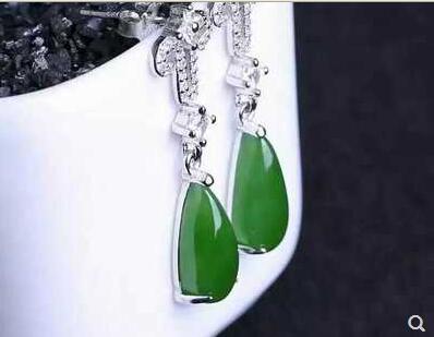 30/5000 Xinjia30/5000 Xinjiang pure natural and tian jade jasper earring female model 925 silver inlaid with the green fashionable earrings.