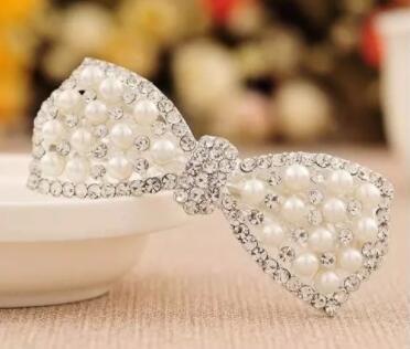 The latest fashion hot-selling bow pearl rhinestone spring clip hairpin female head jewelry