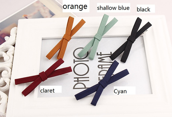 Cloth bow knot cross hairpin trinket