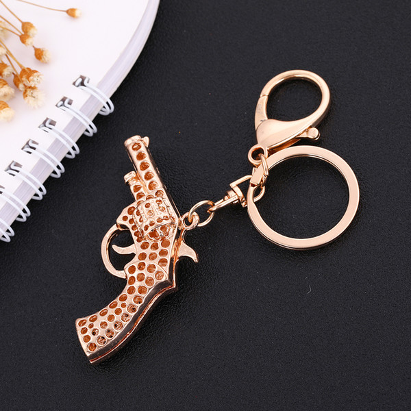 Lemegeton Wholesale Newest Hotselling Dropshipping Fashionable Retail Fashion Luxury White Crystal Gun Shaped Custom Keychain Metal