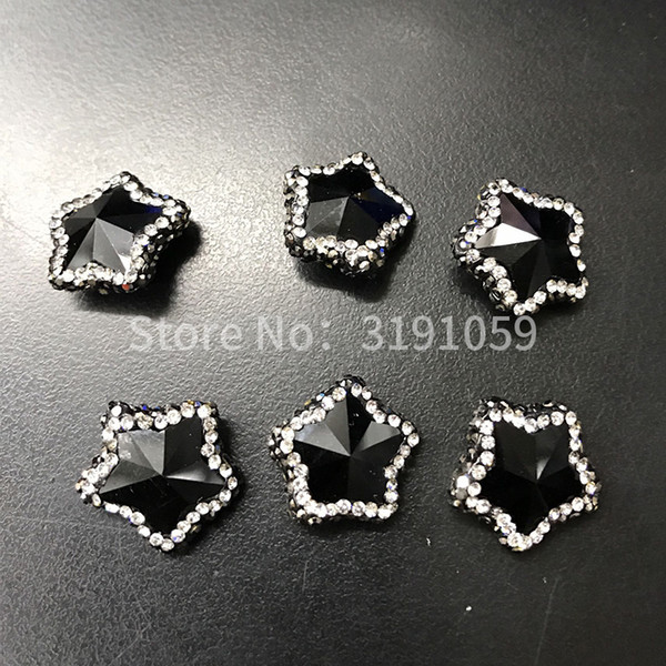 The black pentagonal star is made of crystal and simple beads