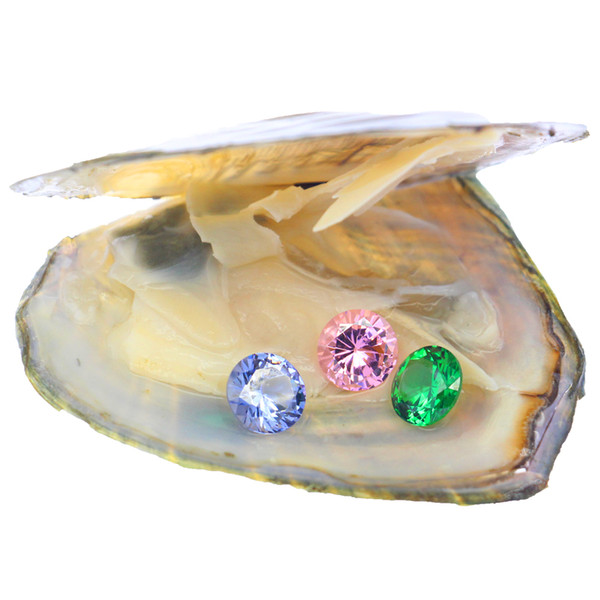 Three 8mm*8mm loose round cubic zircons of different color are displayed in vacuum-packed oysters