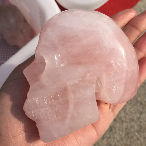 Natural pink crystal fluorite carved skull ornament