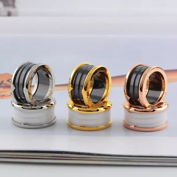 2018 Rose gold male and female rings titanium steel arc black and white ceramic ring spring ring 18 K wide Edition