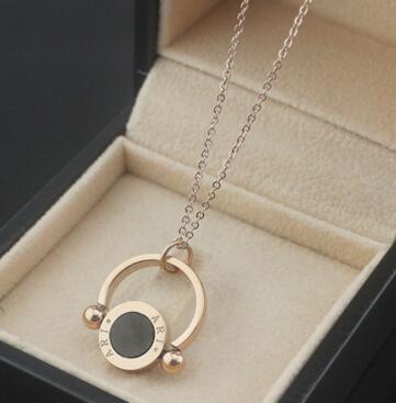 Wholesale titanium steel rose gold necklace foreign trade agent ring hollow double-sided black and white shell necklace