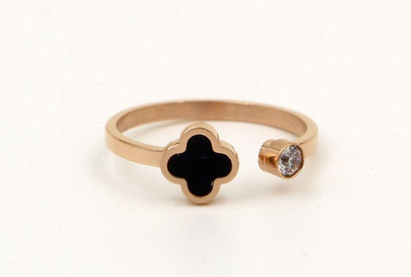 Korean version of stone care black four leaf flower titanium steel plated rose gold ring female fashion ring forefinger ring fingers