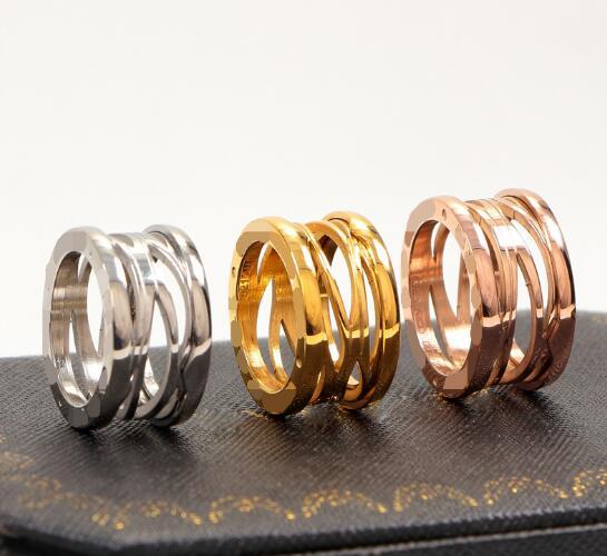 European and American fashion couple hollow spring plated 18K gold ring couple ring, men and women titanium steel rose gold ring