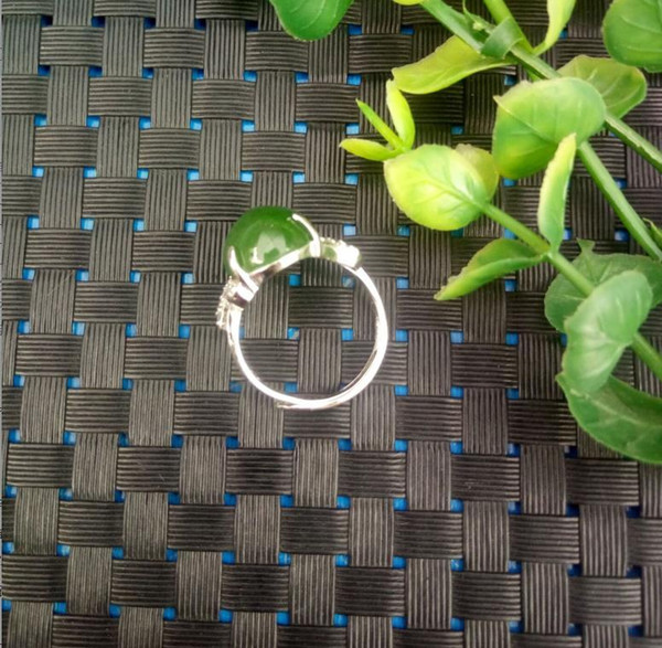 A new natural Hetian jade jade ring spinach green jade ring of slipknot 925 silver and diamond ring