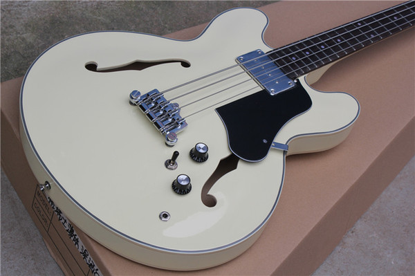 -hollow double f hole four string electric bass cream-colored piano body black guard rosewood