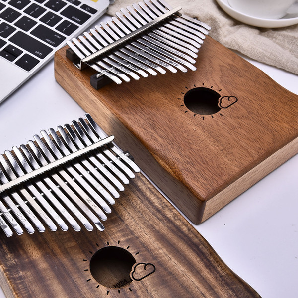 Muspor17 key peach MAHOGANY / acacia wood box EQ thumb piano, and the Kalimba vibrato.