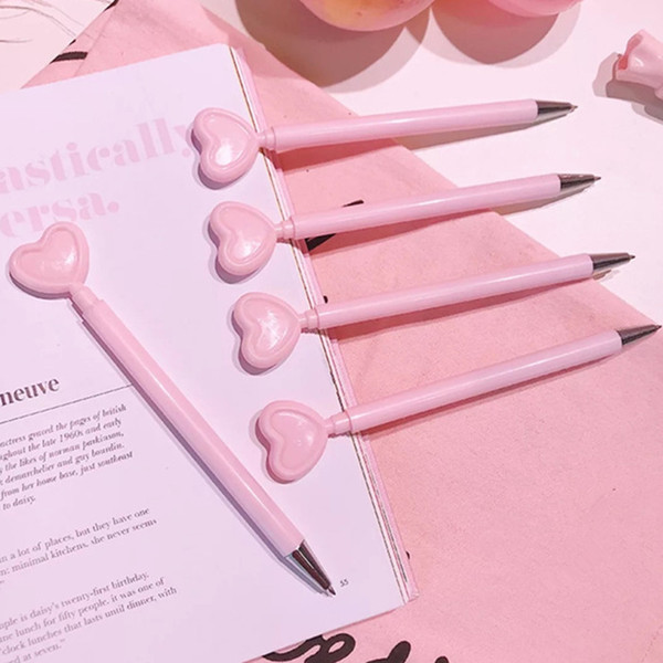 24 pcs/Lot Pink heart gel ink pen Black color Girl love pens Table Decoration Stationery Office School student supplies